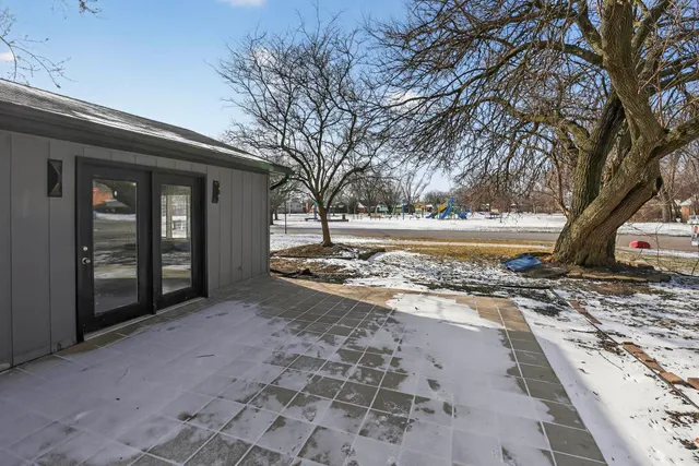 a view of a yard with wooden fence