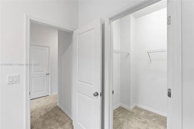 a view of storage and utility room with washer and dryer