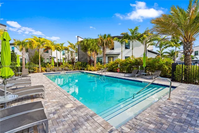 a view of a swimming pool with a patio