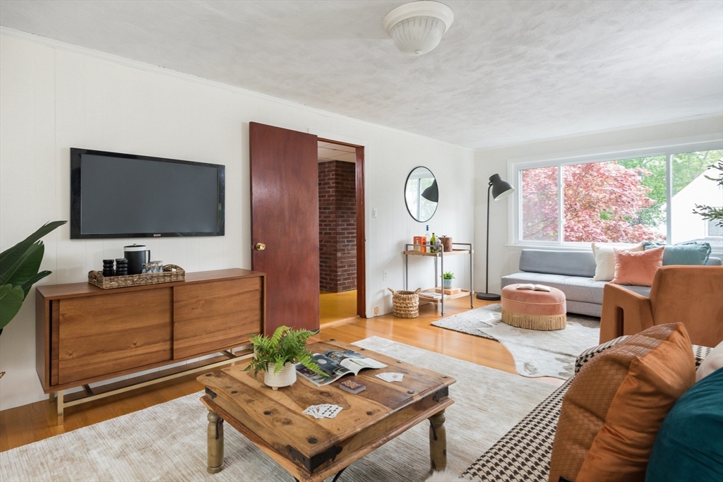 67 Smith Street Arlington, MA 02476 - Photo 13 of 32 a living room with furniture and a flat screen tv