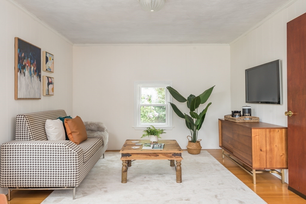67 Smith Street Arlington, MA 02476 - Photo 16 of 32 a living room with furniture and a flat screen tv