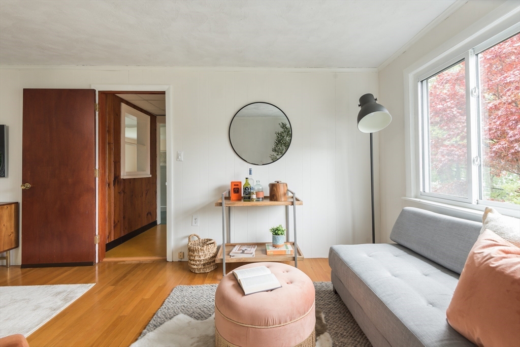 67 Smith Street Arlington, MA 02476 - Photo 18 of 32 a living room with furniture and a window
