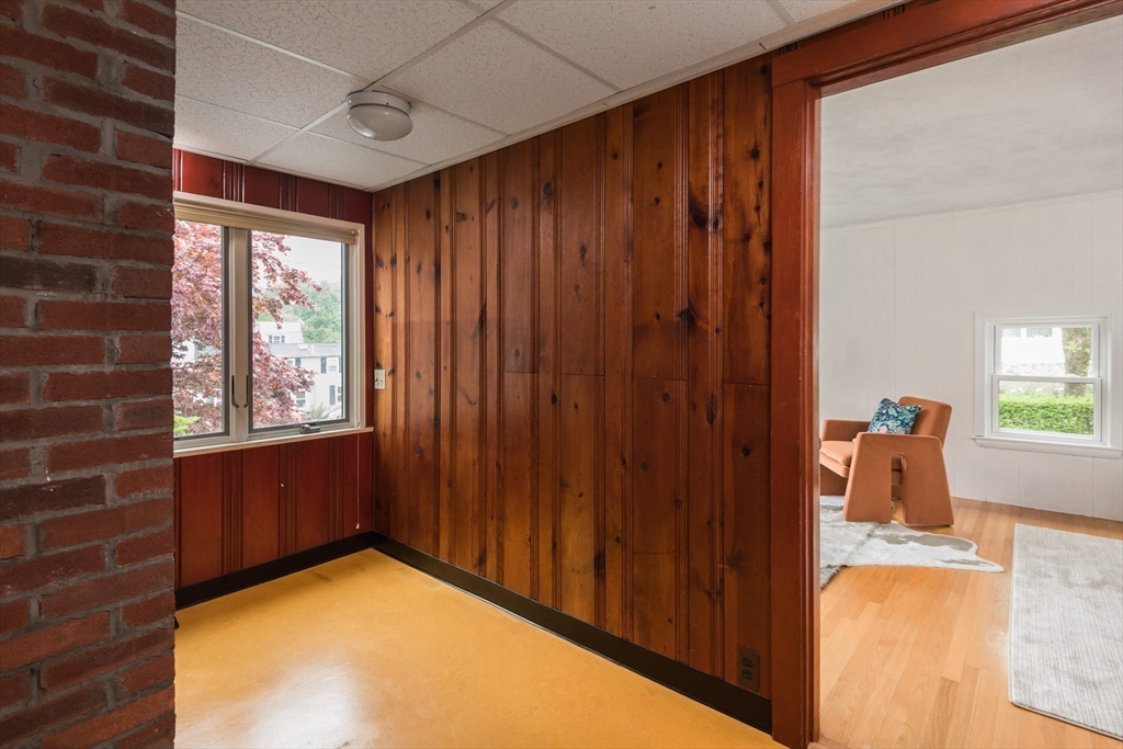 67 Smith Street Arlington, MA 02476 - Photo 19 of 32 a view of an empty room with window and wooden floor