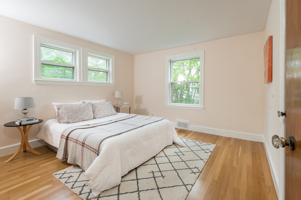 67 Smith Street Arlington, MA 02476 - Photo 20 of 32 a bedroom with a bed and a window