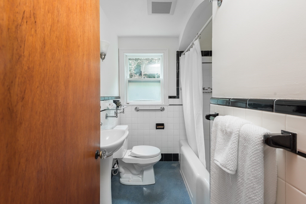 67 Smith Street Arlington, MA 02476 - Photo 22 of 32 a bathroom with a toilet and a shower