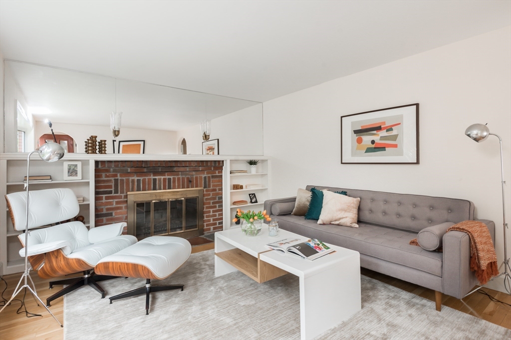 67 Smith Street Arlington, MA 02476 - Photo 3 of 32 a living room with furniture and a fireplace