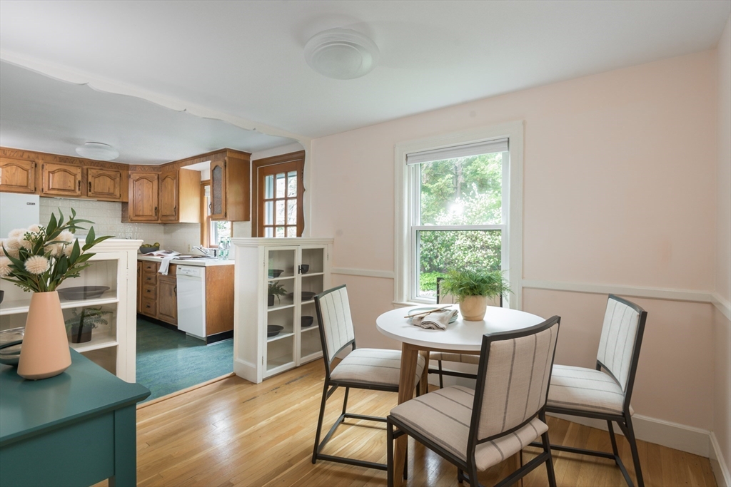 67 Smith Street Arlington, MA 02476 - Photo 7 of 32 a view of a dining room with furniture and wooden floor
