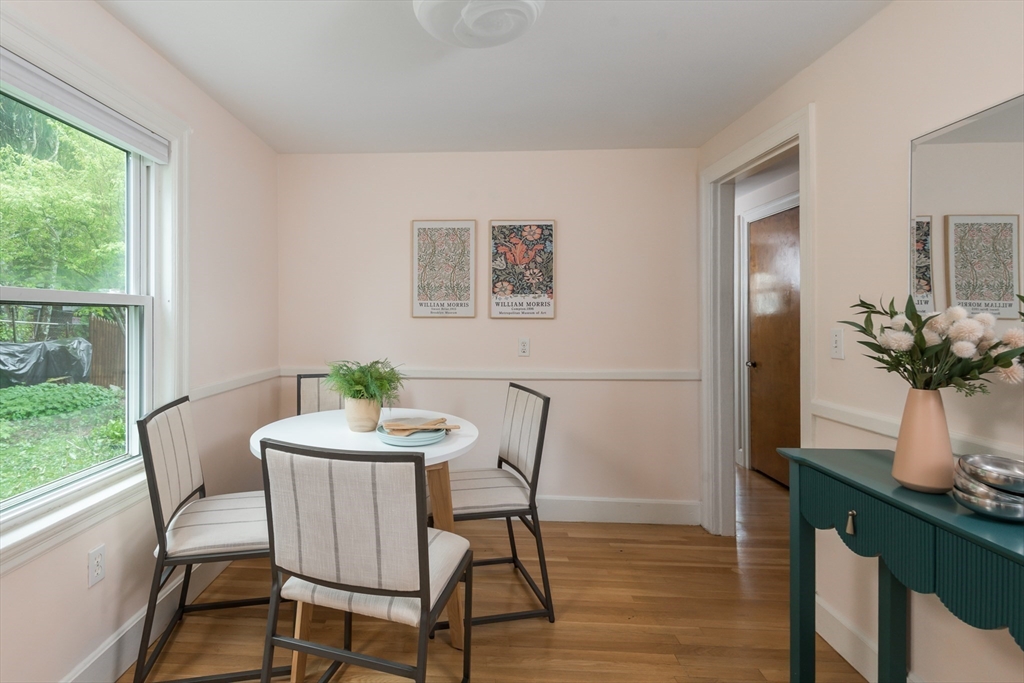 67 Smith Street Arlington, MA 02476 - Photo 9 of 32 a view of a dining room with furniture window and wooden floor