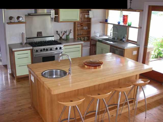 60 South Holokai Road Haiku, HI 96708 - Photo 15 of 30 a kitchen with a stove and white cabinets