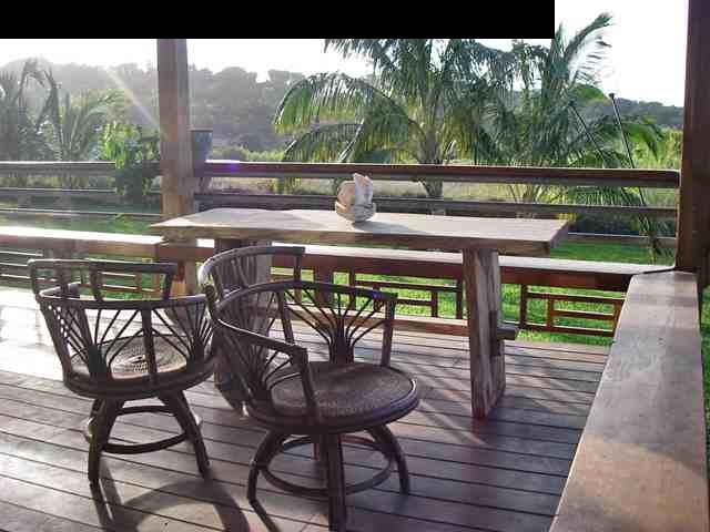 60 South Holokai Road Haiku, HI 96708 - Photo 17 of 30 a view of balcony with chairs and wooden floor