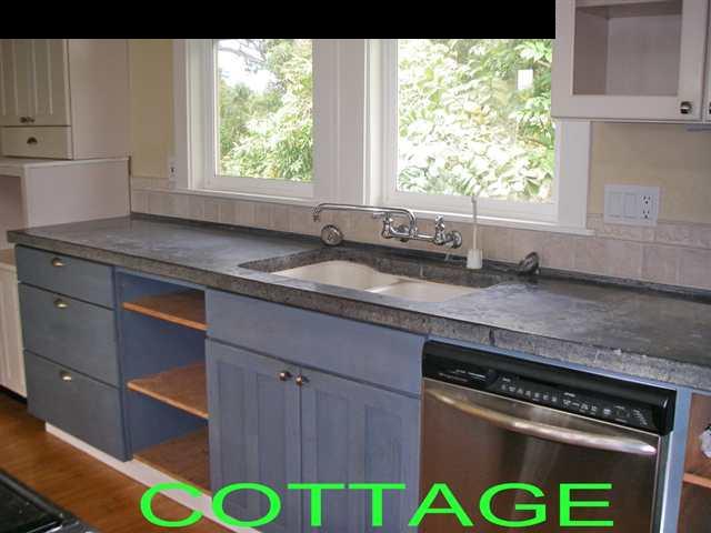 60 South Holokai Road Haiku, HI 96708 - Photo 23 of 30 a kitchen with a stove a sink and a window