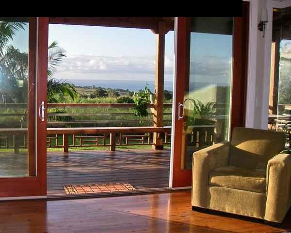 60 South Holokai Road Haiku, HI 96708 - Photo 4 of 30 a view of a balcony with couches and wooden floor