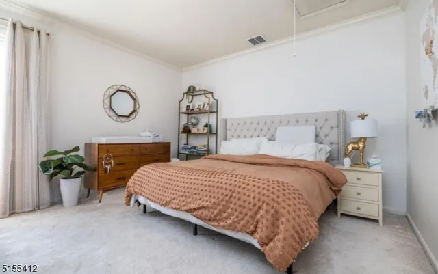 a bedroom with a bed and a table in it