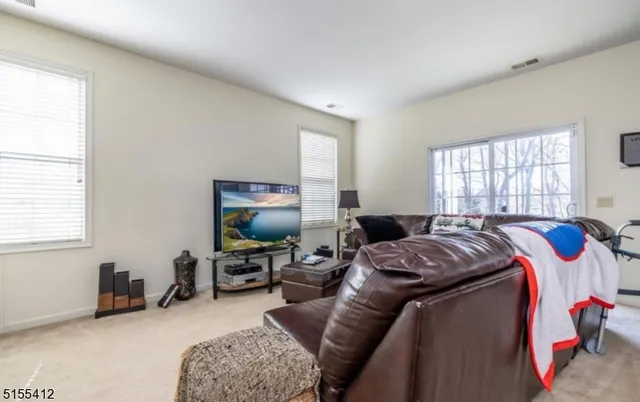 a bedroom with a bed furniture and a window