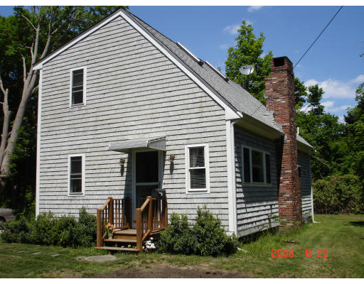 18 Old Bridge Road Bourne, MA 02532 - Photo 1 of 14 a view of a house with a yard and potted plants