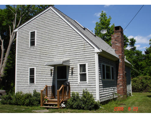 18 Old Bridge Road Bourne, MA 02532 - Photo 3 of 14 a view of a house with a yard and potted plants