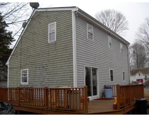 18 Old Bridge Road Bourne, MA 02532 - Photo 4 of 14 a front view of a house with balcony