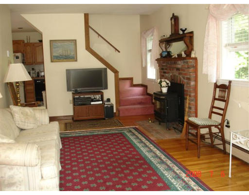 18 Old Bridge Road Bourne, MA 02532 - Photo 6 of 14 a living room with furniture and a fireplace