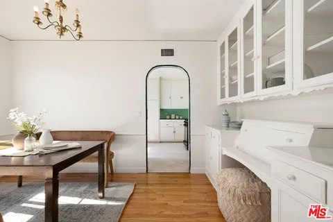 a workspace with furniture and mirror