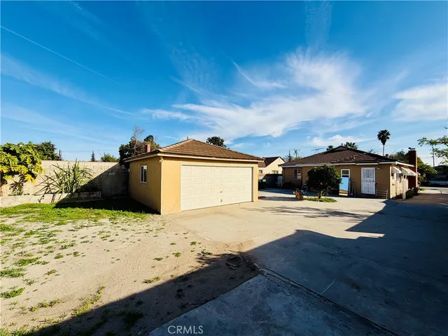 a view of a house with patio outdoor kitchen