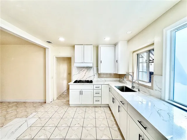 a view of a room with a flat screen tv