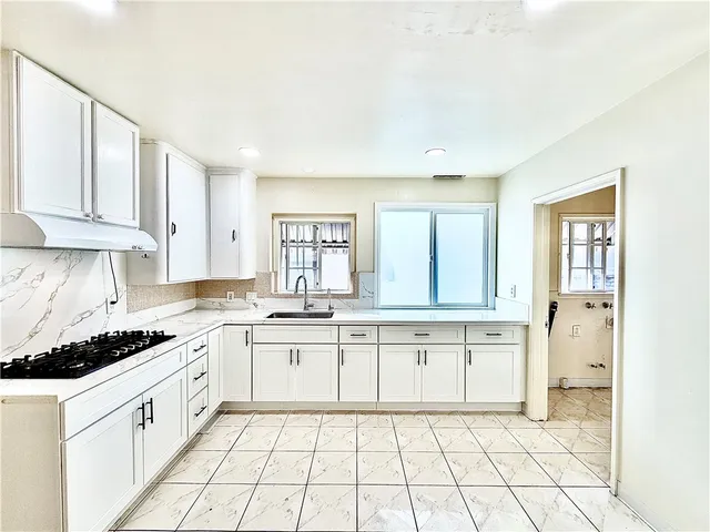 a view of a kitchen with furniture and a kitchen view