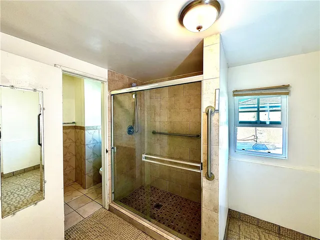 a bathroom with a sink vanity and a mirror