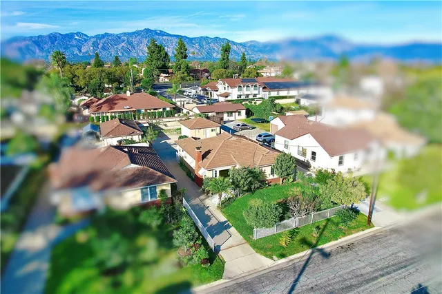 a view of swimming pool with a yard and plants