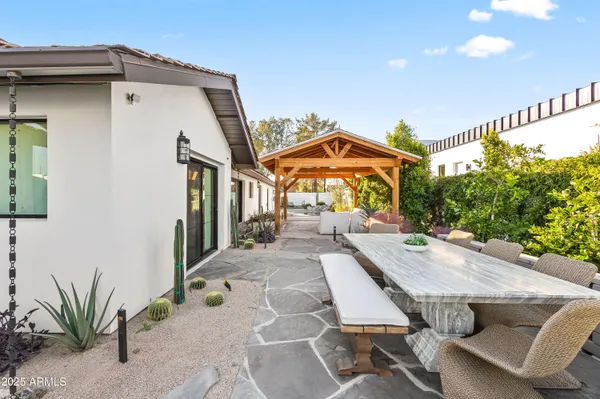a view of a house with patio front of house