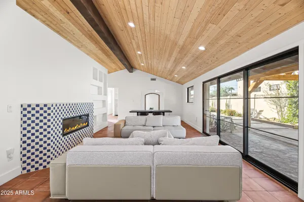 a bedroom with a large bed and a large window