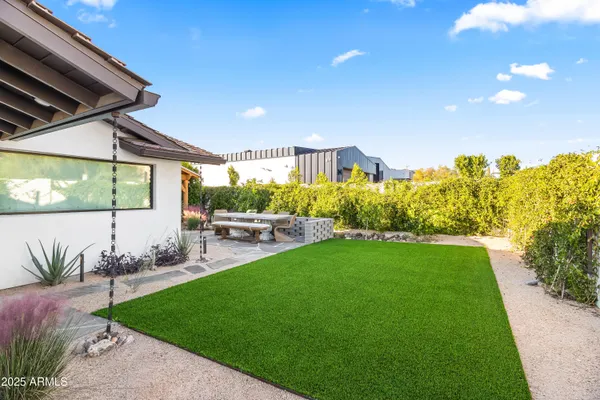 a view of a backyard of the house
