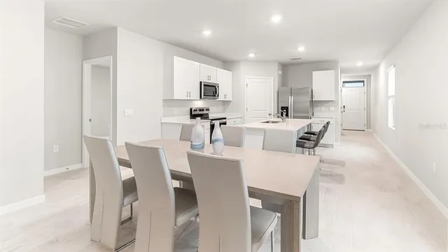 a view of a dining room with furniture