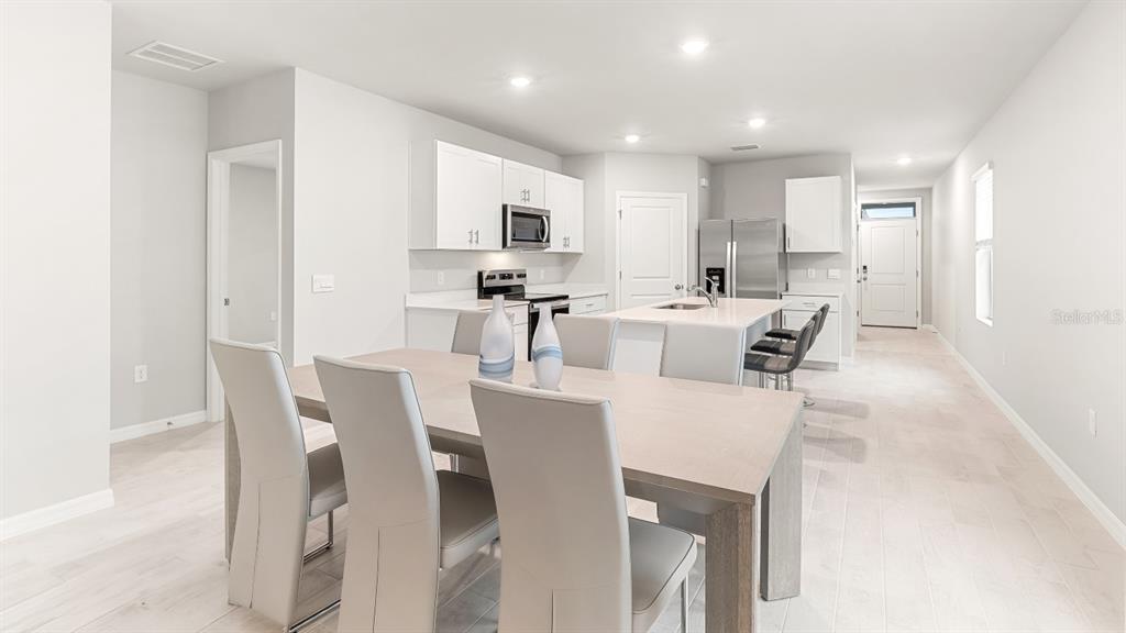 2994 Northeast 21st Ct Road Ocala, FL 34479 - Photo 3 of 9 a view of a dining room with furniture