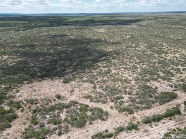 a view of a lake with a yard