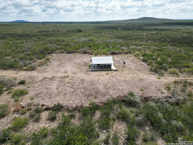 a view of a yard with an ocean