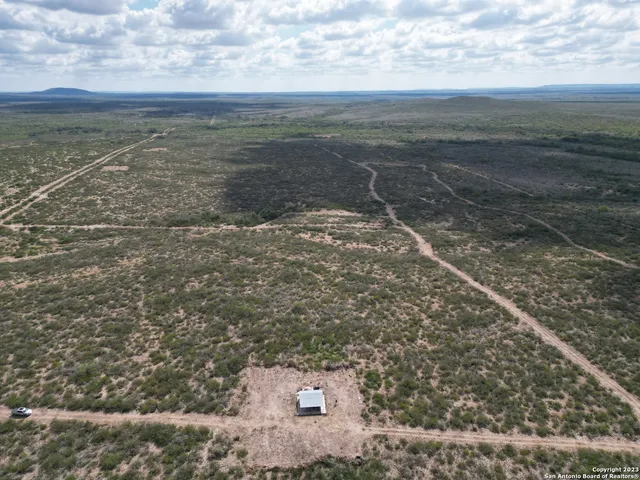 a view of a yard with an outdoor space