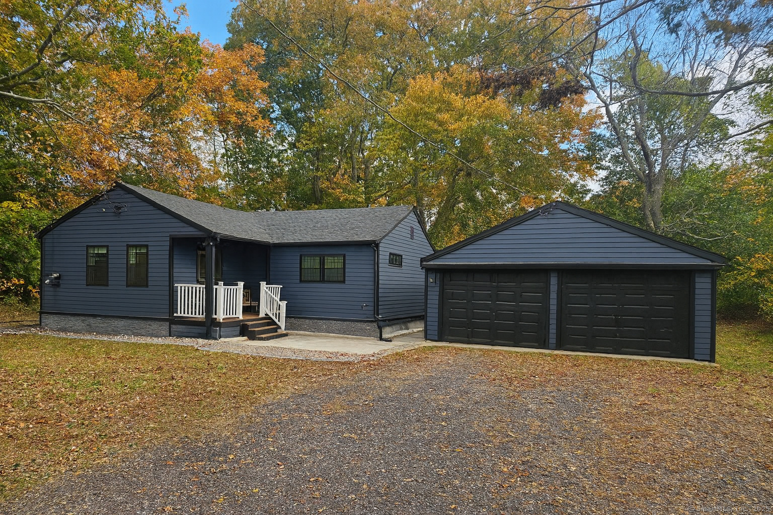 a house with large trees in front of it