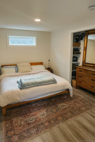 a bedroom with a bed and a walk in closet