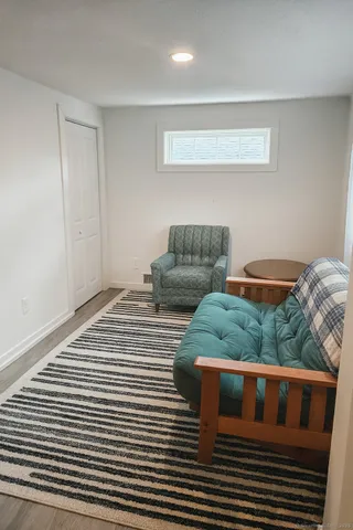 a bedroom with bed and a couch