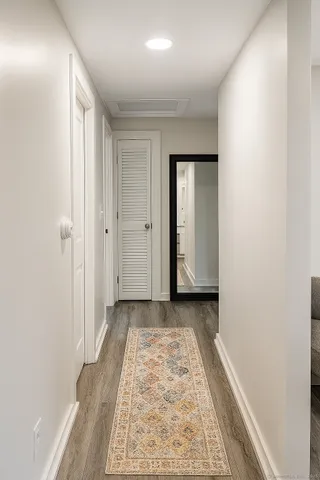 a view of a room with a wooden floor and a window