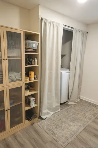 a view of walk in closet with empty racks