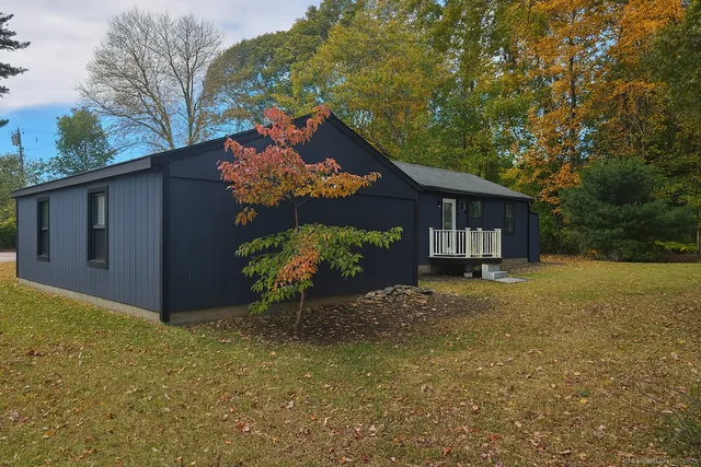 a view of a house with a tree