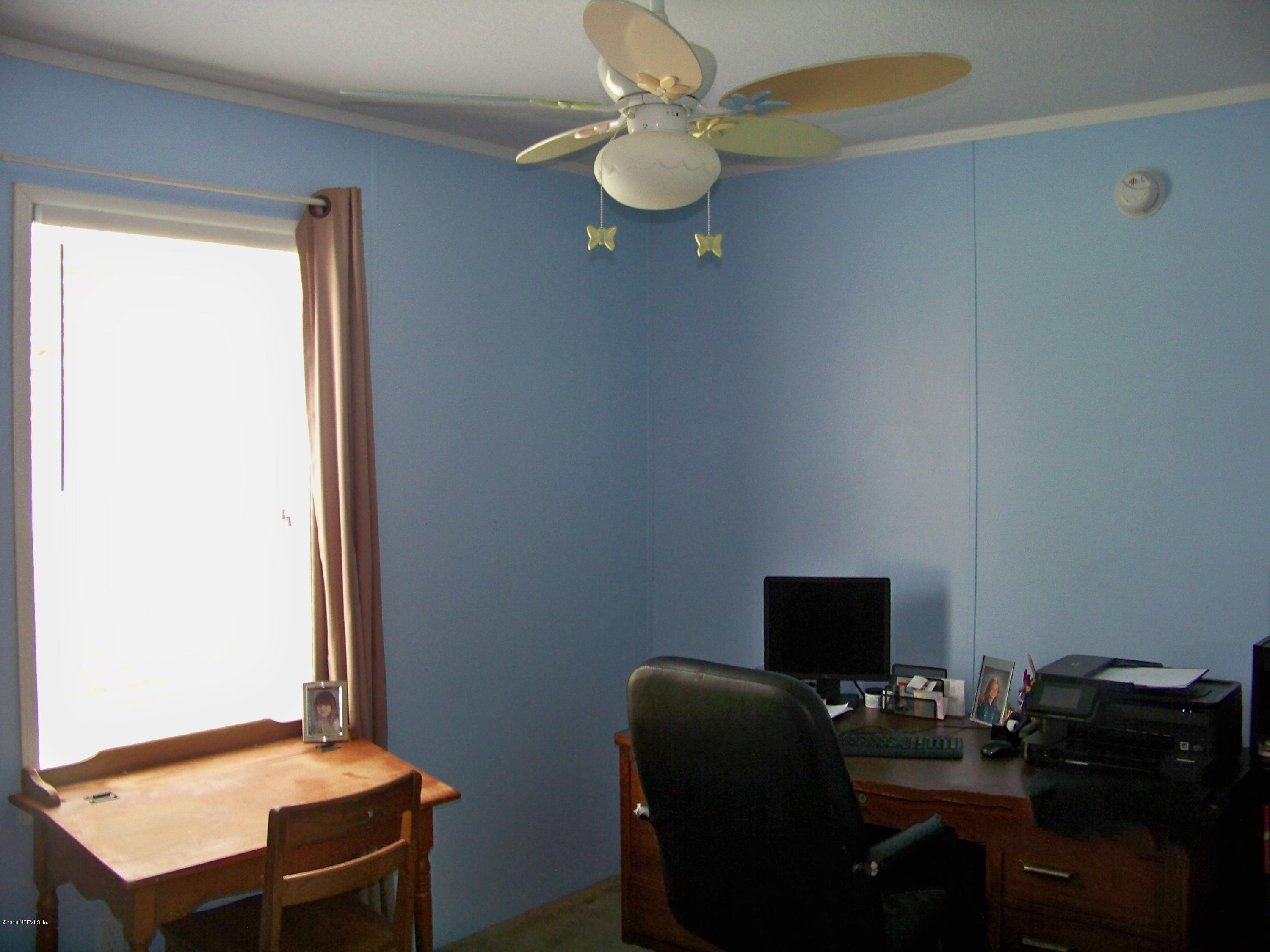 54314 Lawhon Road West Callahan, FL 32011 - Photo 20 of 30 a work room with furniture and a window