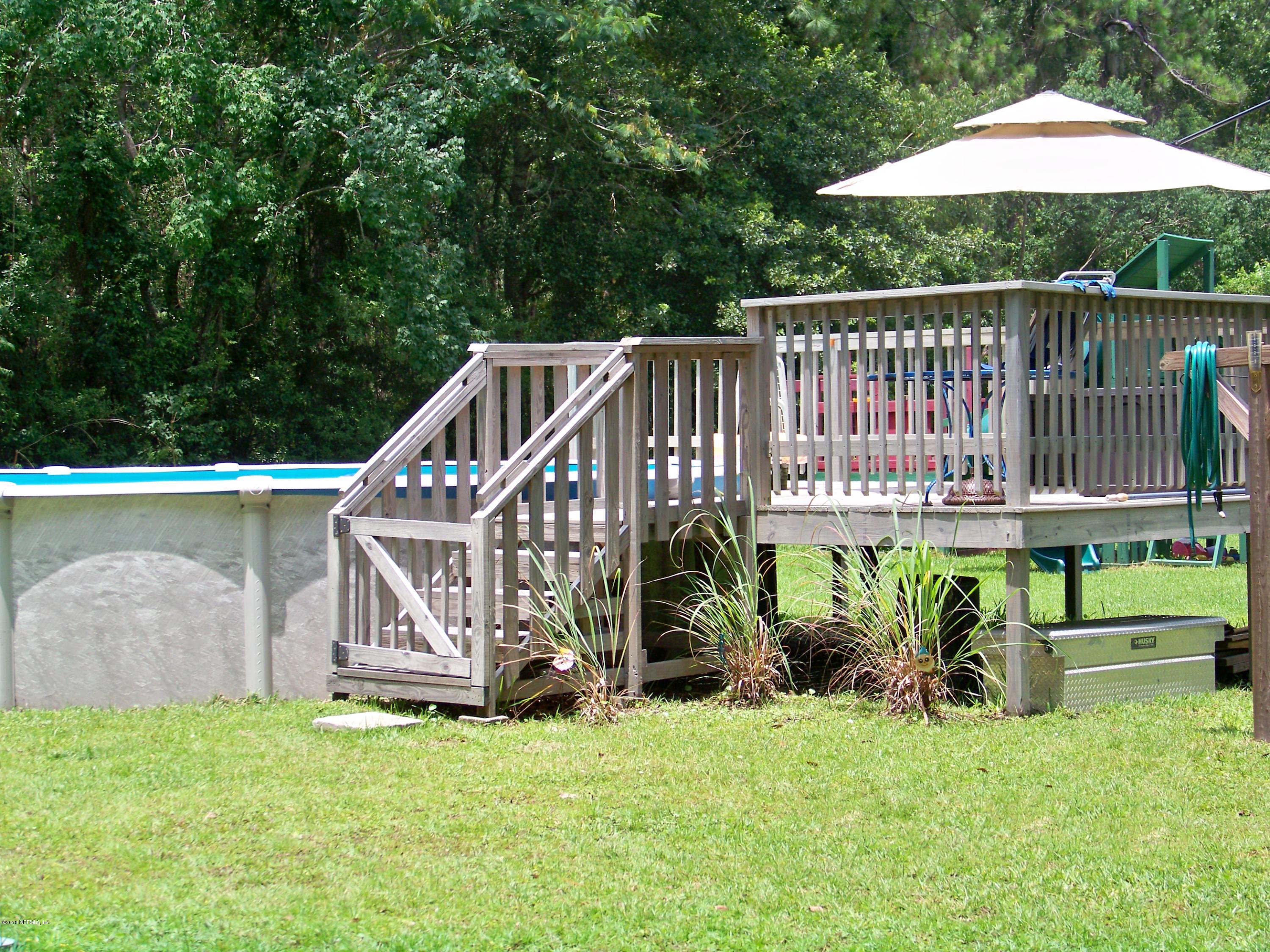 54314 Lawhon Road West Callahan, FL 32011 - Photo 24 of 30 a view of a house with backyard and sitting area