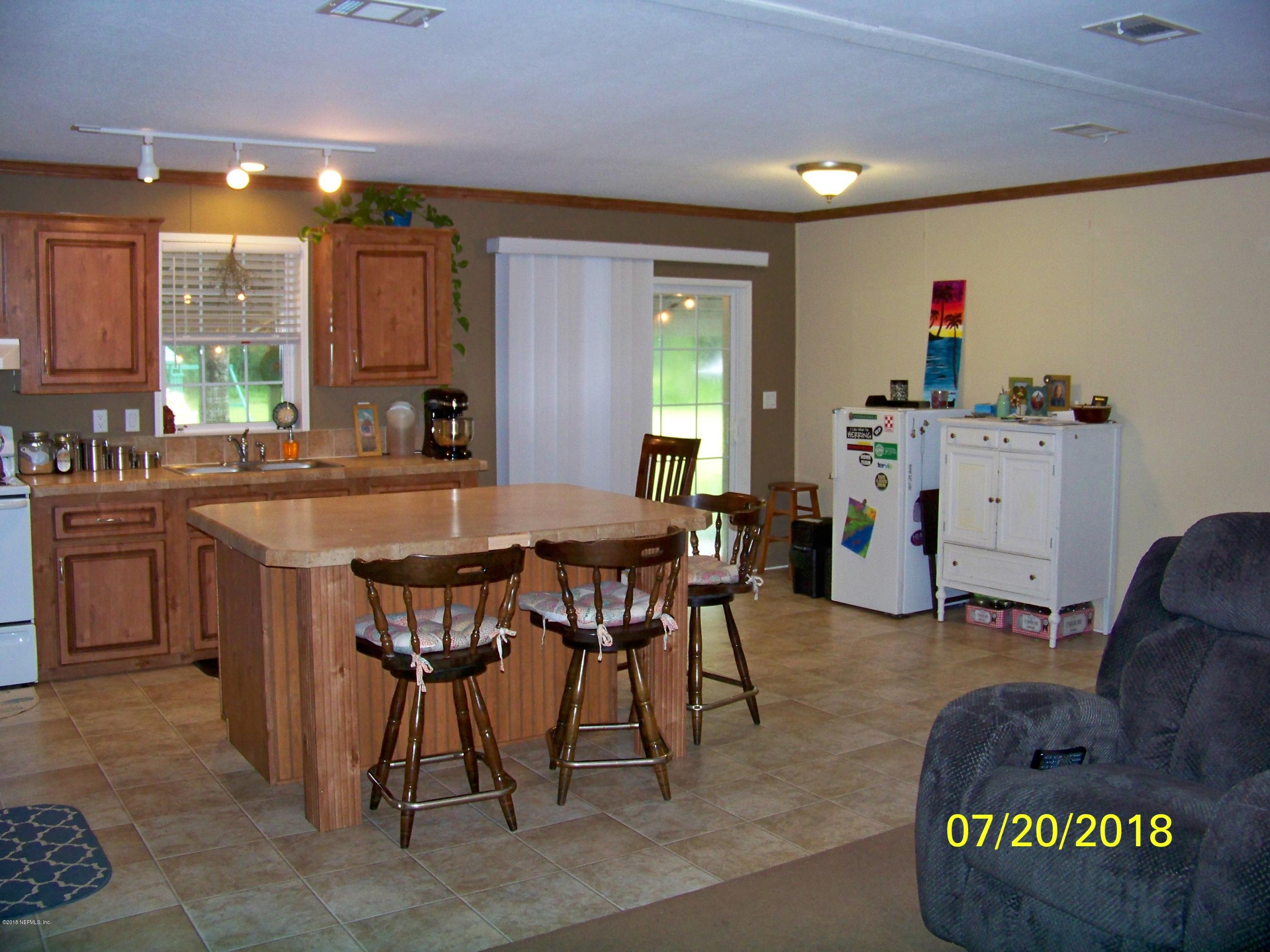 54314 Lawhon Road West Callahan, FL 32011 - Photo 6 of 30 a view of a dining room with furniture and a window