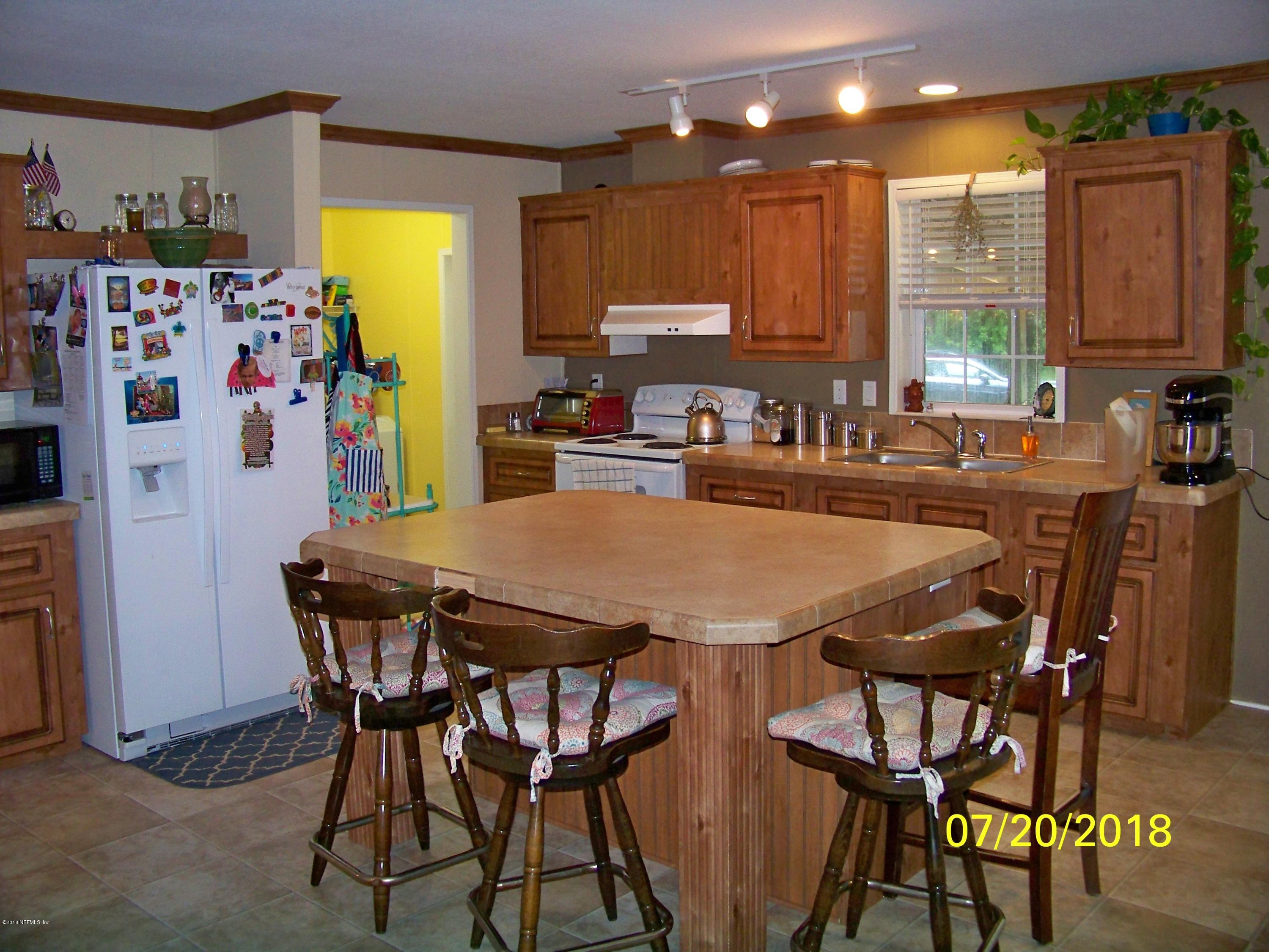 54314 Lawhon Road West Callahan, FL 32011 - Photo 7 of 30 a view of a dining room with furniture and a window