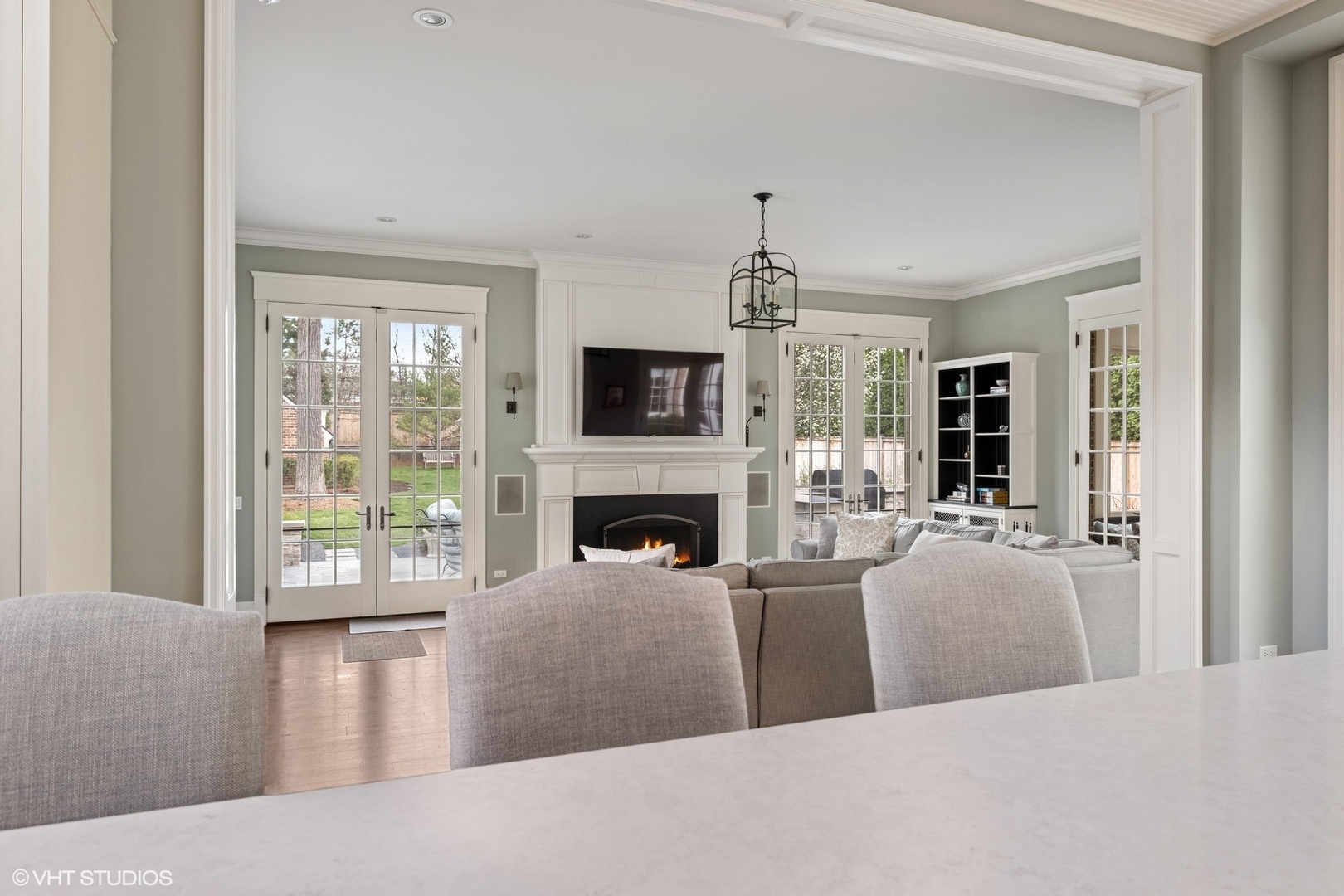 725 Walden Road Winnetka, IL 60093 - Photo 11 of 84 a living room with furniture a fireplace and a flat screen tv