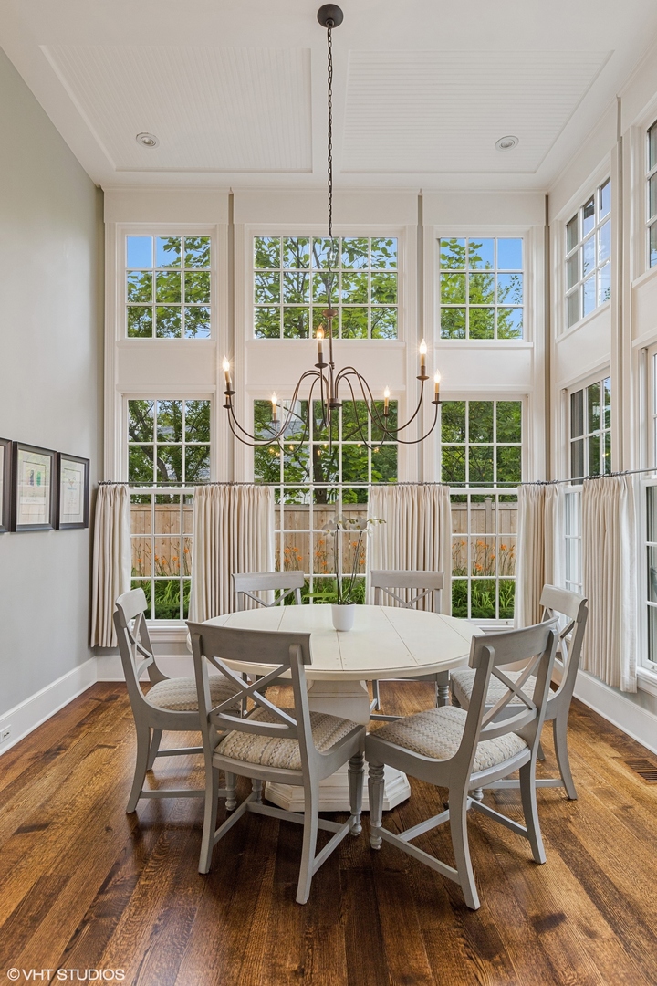 725 Walden Road Winnetka, IL 60093 - Photo 14 of 84 a dining room with furniture window and wooden floor