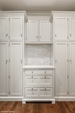 a living room with furniture a mirror and a fireplace