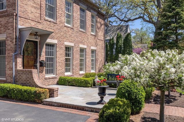 a living room with furniture kitchen view and a window